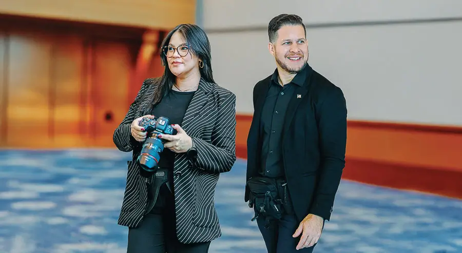 Barbara Gomez and Luis Rivas, corporate event photographers at District Pixel, on location covering a professional event in Washington DC.