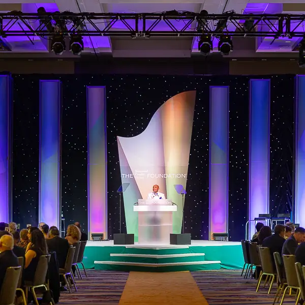 Corporate award ceremony presentation on stage during a formal event in Washington DC