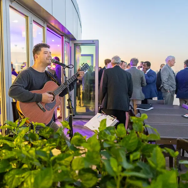 Professionals networking and conversing during a corporate business event in Washington DC