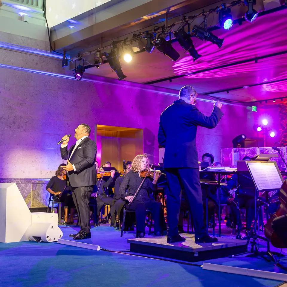 American Dream Orchestra musicians on stage at the Milken Institute inauguration gala in Washington, DC