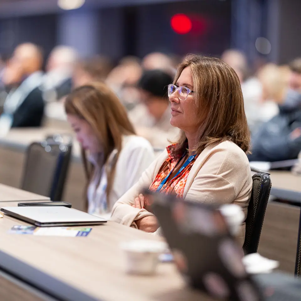 Conference attendee smiling during an FDA-PDA Annual Conference education session