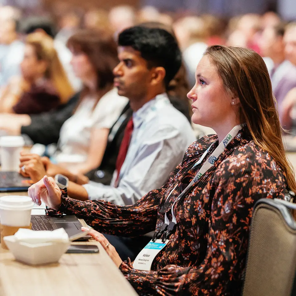 FDA-PDA Annual Conference attendees taking notes during a professional education session