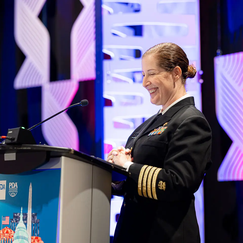 Uniformed speaker presenting from the FDA-PDA Annual Conference podium