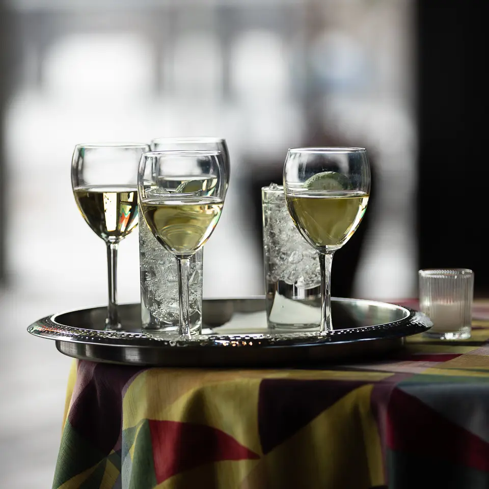 Wine glasses on a service tray during the FDA-PDA Annual Conference reception