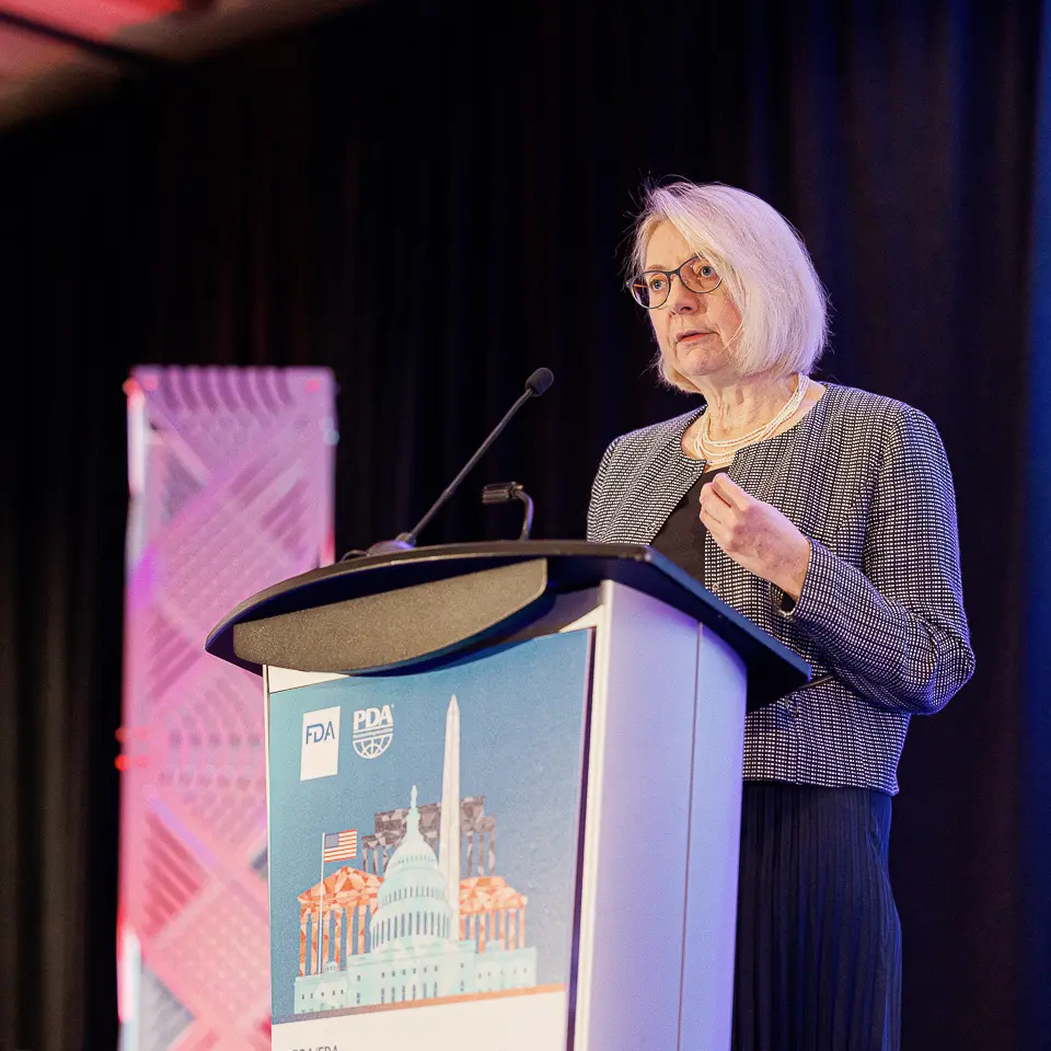 Woman speaker presenting from the FDA-PDA Annual Conference podium at The Westin