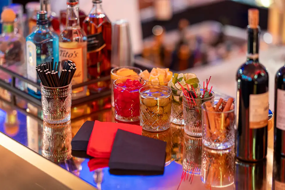 Reception bar detail with spirits, cocktail garnishes, and glassware at the University of Maryland Forward event