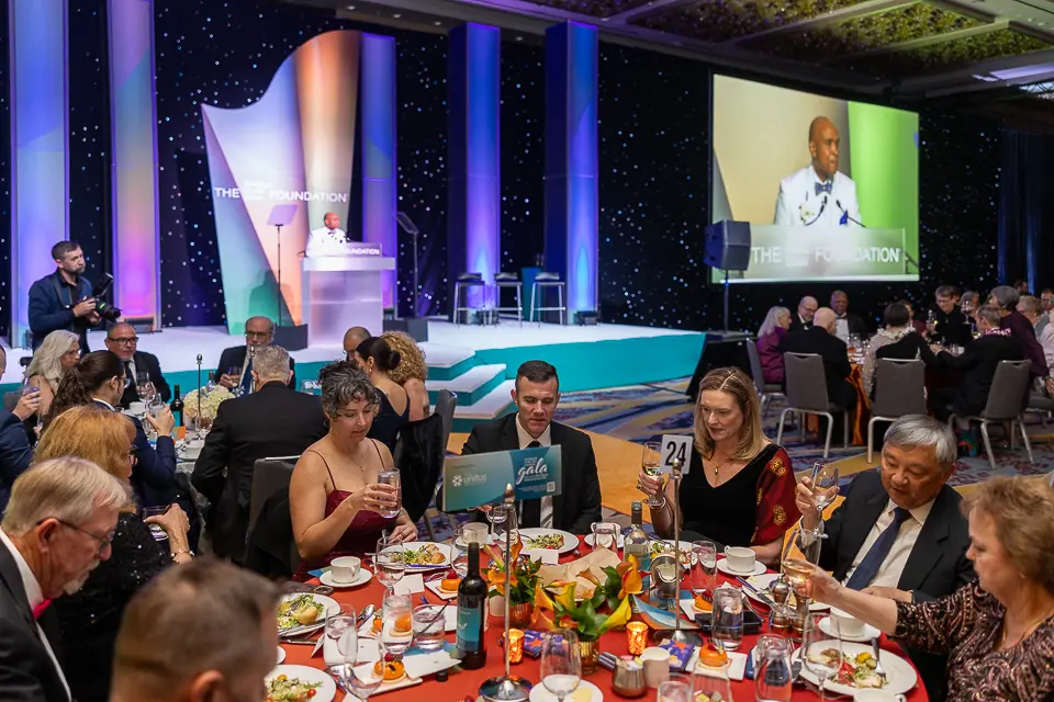Awards dinner guests seated beneath stage screens during the Herb Wegner Awards 2026 program.
