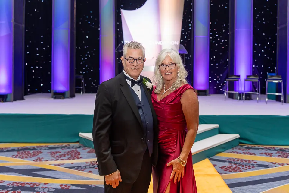 Couple portrait on the Herb Wegner Awards 2026 stage after the evening recognition program.