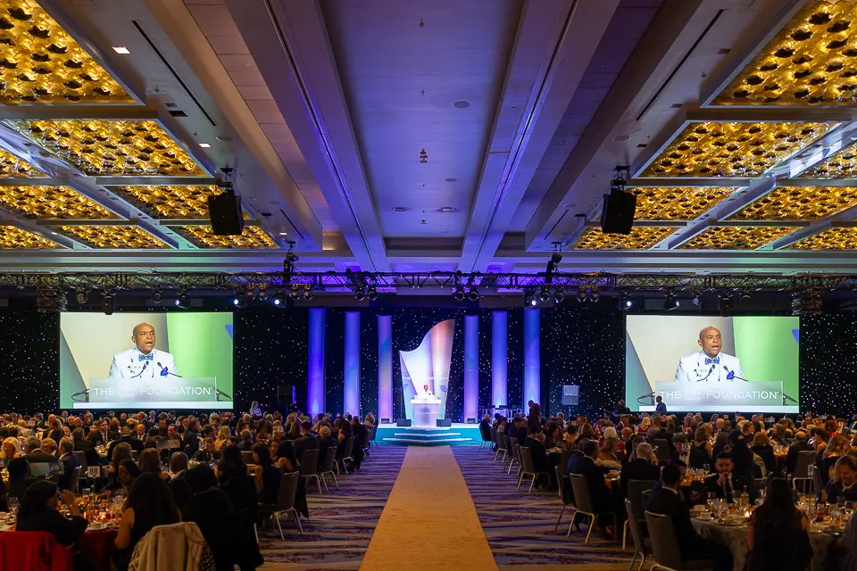 Herb Wegner Awards 2026 ballroom with stage screens showing the speaker during the evening program.
