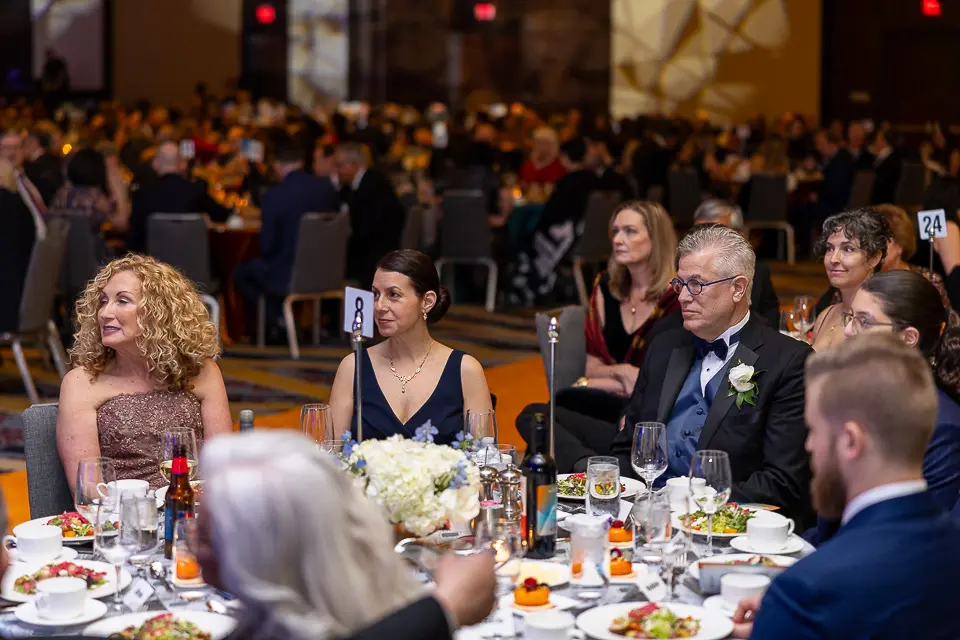 Dinner guests applauding at their table during the Herb Wegner Awards 2026 gala.