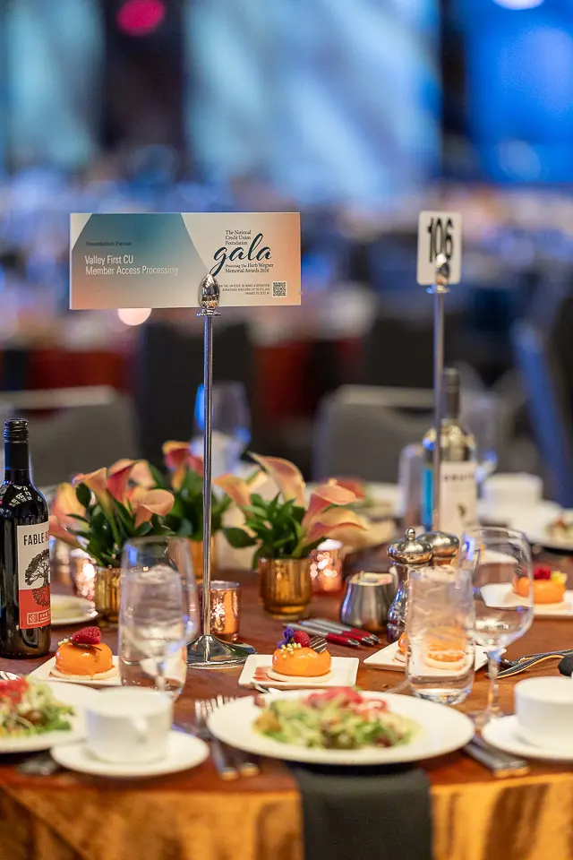Floral centerpiece, glassware, and place settings arranged for guests at the Herb Wegner Awards 2026 gala.