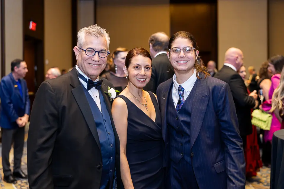 Three gala guests posing together during the Herb Wegner Awards 2026 reception.