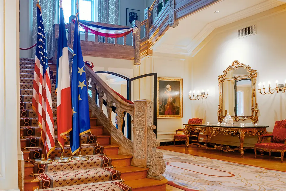 Grand staircase framed by flags and red white and blue event draping