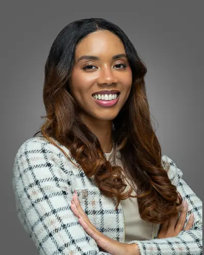 Professional corporate headshot of a woman in plaid blazer photographed in Washington DC by District Pixel
