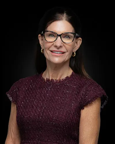 Professional corporate headshot of a woman with glasses photographed in Washington DC by District Pixel
