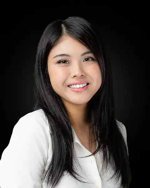 Professional corporate headshot of a young Asian woman photographed in Washington DC by District Pixel